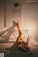 A woman laying on a bed in a bedroom.